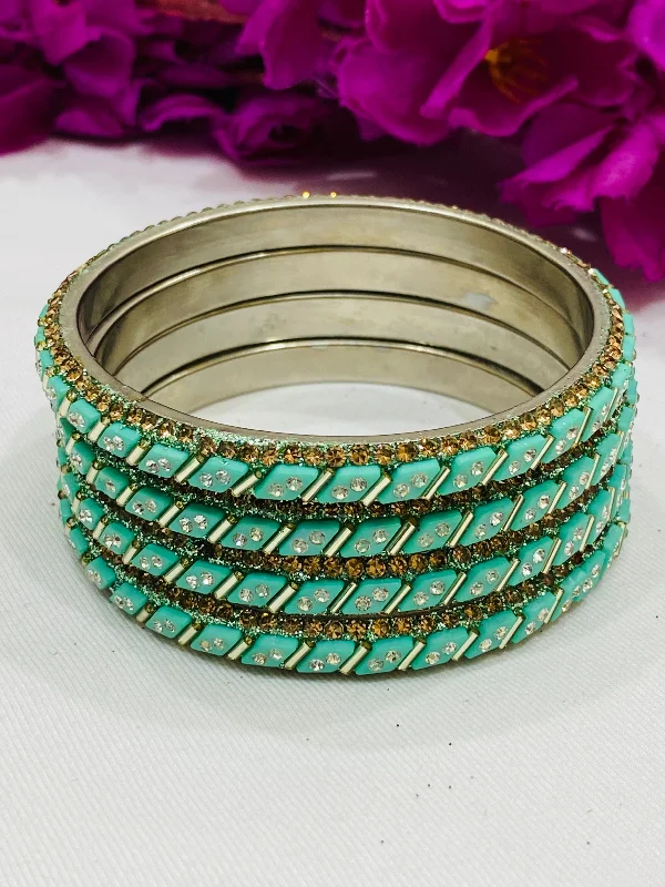 Bangles with malachite stones for green swirls -Pleasing Pista Green Color Metal Bangles With White Stone For Women