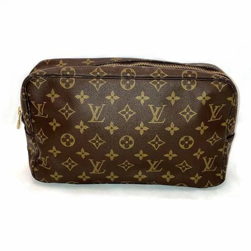 Handle bags with bohemian tassel embellishments -Louis Vuitton Monogram  Monogram Clutch Bag (Pre-Owned)