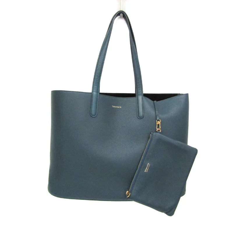 Reversible handle bags offering dual design styles -Tiffany  Leather Tote Bag (Pre-Owned)