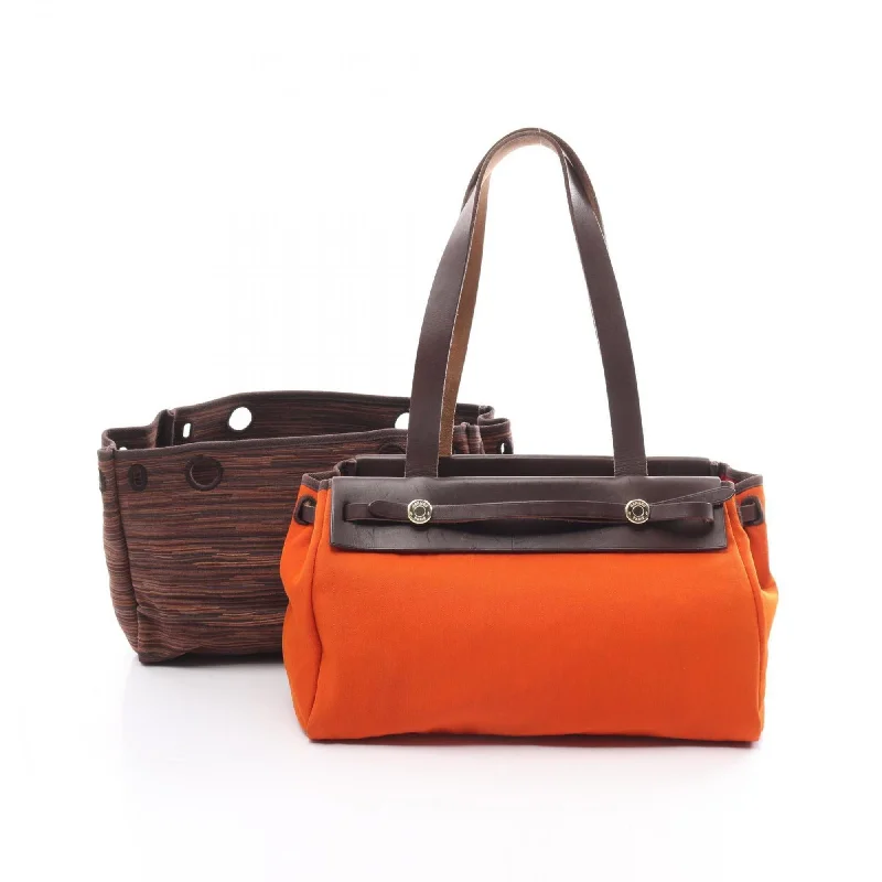 Handle bags with colorful handles for flair -Hermes   Toile Officier Tote Bag (Pre-Owned)