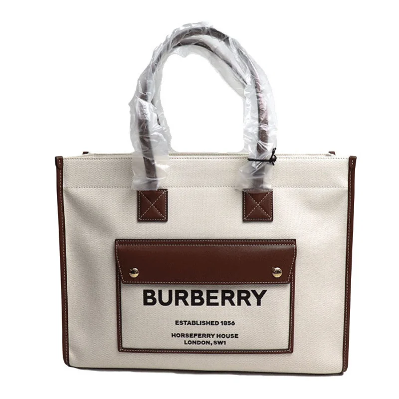 Handle bags with perforated details for style -Burberry Canvas Leather Tote Bag (Pre-Owned)