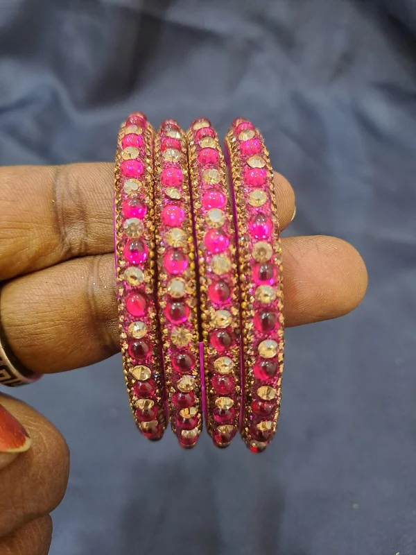 Bracelets with spiral designs for eye-catching twist -Stunning Pink Color Glass Bangles With Flashing Stone For Women