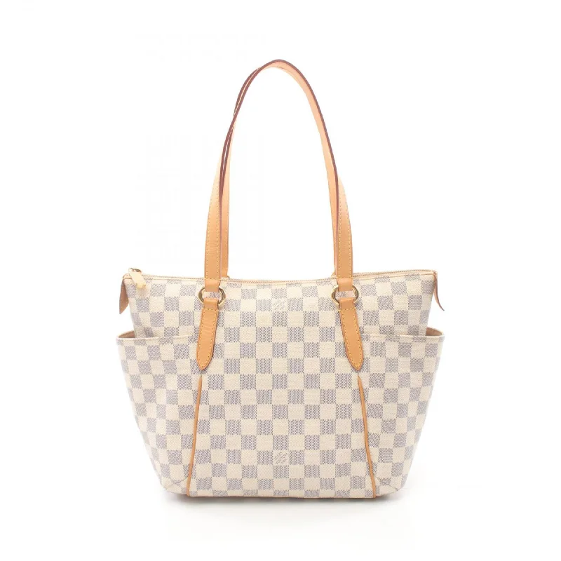 Handle bags with sleek hardware for sophistication -Louis Vuitton  Pvc Leather Tote Bag (Pre-Owned)