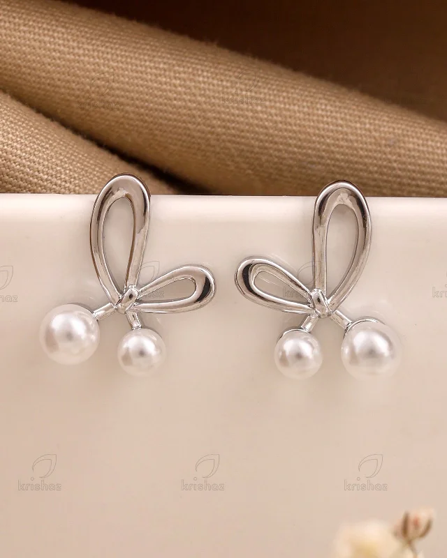 Hoop earrings with heart-shaped frames for a romantic and feminine look-Dottie Bow Fashionable Studs